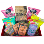 Assorted snack items including popcorn, beer mix, and small containers in a box.