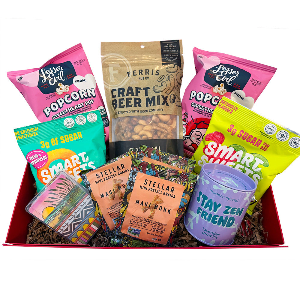 Assorted snack items including popcorn, beer mix, and small containers in a box.