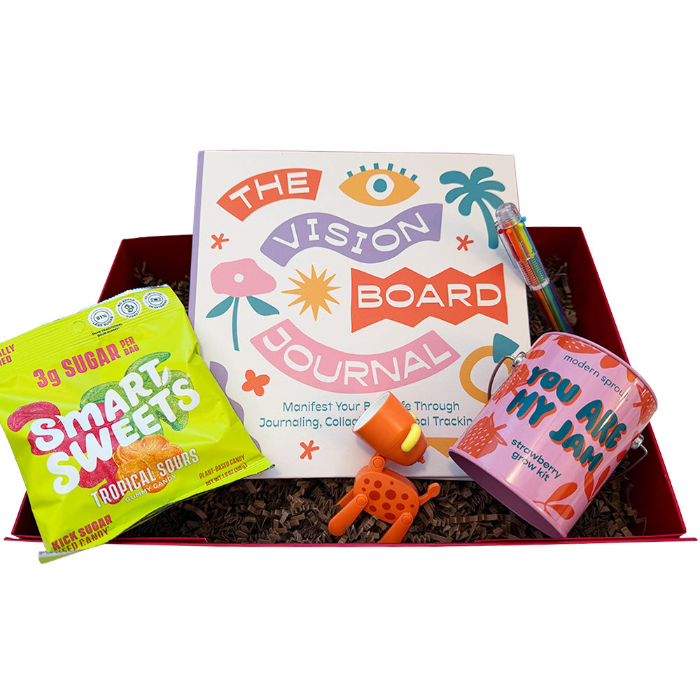 Gift box with 'The Vision Board Journal', 'Smart Sweets' package, and 'You Are My Jam' container on a white background